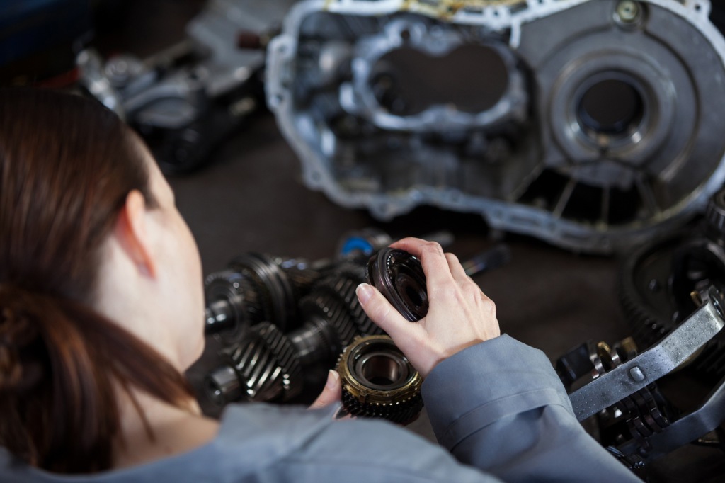 female mechanic fixing gear 1